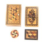 Four pieces of Tunbridge ware comprising a needlebook with floral mosaic covers, 9 x 5.7cm, a