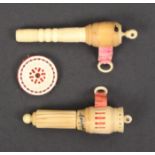 Two vegetable ivory combination tape measure/needlecases and a pincushion, all with Stanhopes,