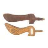 Two 19th Century wooden carved knitting sheaths, Teesdale, comprising a chip carved beech example,