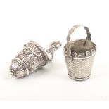 A silver thimble case and a silver pincushion the thimble case of tapering form embossed with leaf