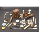 A mixed lot _ sewing _ including knitting needle gauges, a Chinese carved ivory clamp, a wooden