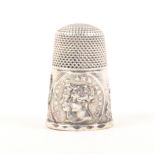A silver Victoria And Albert commemorative thimble the frieze with overlapping portrait profiles and