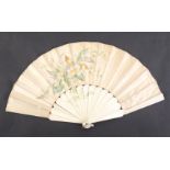 A late 19th Century French fan, ivory sticks and guards, the silk guard and part of the sticks