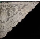 A large triangular Limerick lace shawl and other lace, the shawl with dense floral designs, 128 x