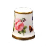 A 19th Century Derby porcelain thimble, Ex Holmes collection, painted with insects and flowers