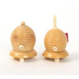 A vegetable ivory tape measure and matching thimble case, each in the form of a bee skep raised on