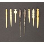 Eight various stilettos comprising a finely carved ivory example, 5.5cm, five others in bone and