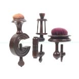 Three rosewood sewing clamps comprising a turned ïCÍ frame example below a vase form pincushion top,