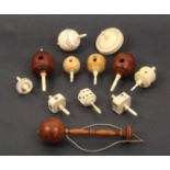 A collection of spinning and humming tops and associated items comprising two coquilla humming