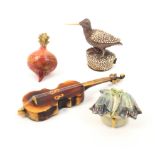 Four novelty celluloid tape measures comprising a radish, 6cm, a cello, 13cm, a bird with shagreen