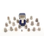 Twenty two English silver thimbles, eight only hallmarked, 19th Century and later including a