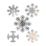 Five various mother of pearl silk winders including two large pierced snowflake examples, largest