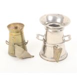 Two metal novelty tape measures in the form of milk churns, one in nickel plate with open thimble