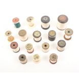 A good comprehensive selection of wooden cotton and other reels all with decorative labels and