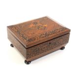 A rosewood Tunbridge ware sewing box circa 1840, of sarcophagal form, the lid with panels and