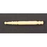 A 19th Century turned ivory tapering knitting stick with leaf carved and spiral turned decoration,