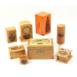 Mauchline ware _ eight pieces comprising a clock form money box (Newbiggin Beach), 11cm, a