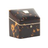 A scarce tortoiseshell combination needlepacket box/thimble case of knife box form, the lid with