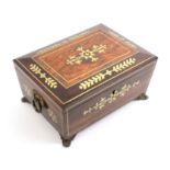 A Regency rosewood sewing box of sarcophagal form inlaid to the lid, front and sides with cut