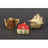 Three novelty celluloid tape measures comprising a sailing ship, 5.5cm, another as a house, 4.2cm,