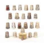A collection of silver and other thimbles comprising six English silver examples, a Dorcas, a