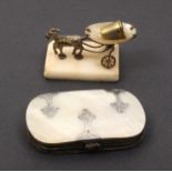 A thimble or pin cart and a mother of pearl purse, the cart in gilt brass with mother of pearl