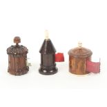 Three wooden tape measures comprising a rosewood example as a turret with bone winder, printed