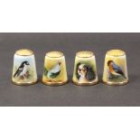 Four 20th Century enamel thimbles by Graham Payne, Worcester comprising one of a dog and three of