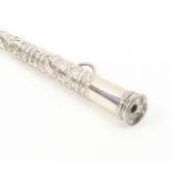 An early 19th Century silver knitting stick of tapering cylinder form, Dutch, with three figural