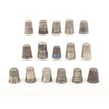 Sixteen continental and American silver and white metal thimbles, most with decorative borders, 19th