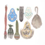 A collection of purses and similar items comprising a green knitted and steel beaded purse, 14cm,