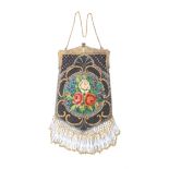 A late 19th Century beadwork ladyÍs dress bag, the gilded metal chain mount with angels and