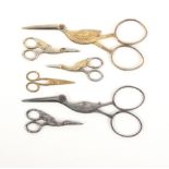 Six pairs of scissors comprising five in the form of storks, comprising a gilded pair and a steel