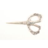 A pair of silver scissors, probably Dutch, the tapering blades marked to one side, the arms and