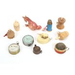 Eleven tape measures comprising four vegetable ivory examples, one formerly with needlecase stem,