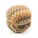 An early 18th Century knitted pin ball in brightly coloured zig zag bands, 4.5cm