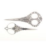 Two fine pairs of steel scissors comprising a pair with diamond section tapering blades,