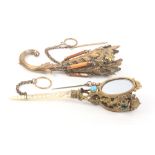 Two late 19th Century posy holders comprising a gilt brass cornucopia form example with leaf and