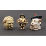 Three novelty tape measures comprising a celluloid example modelled as the head of Lloyd George,