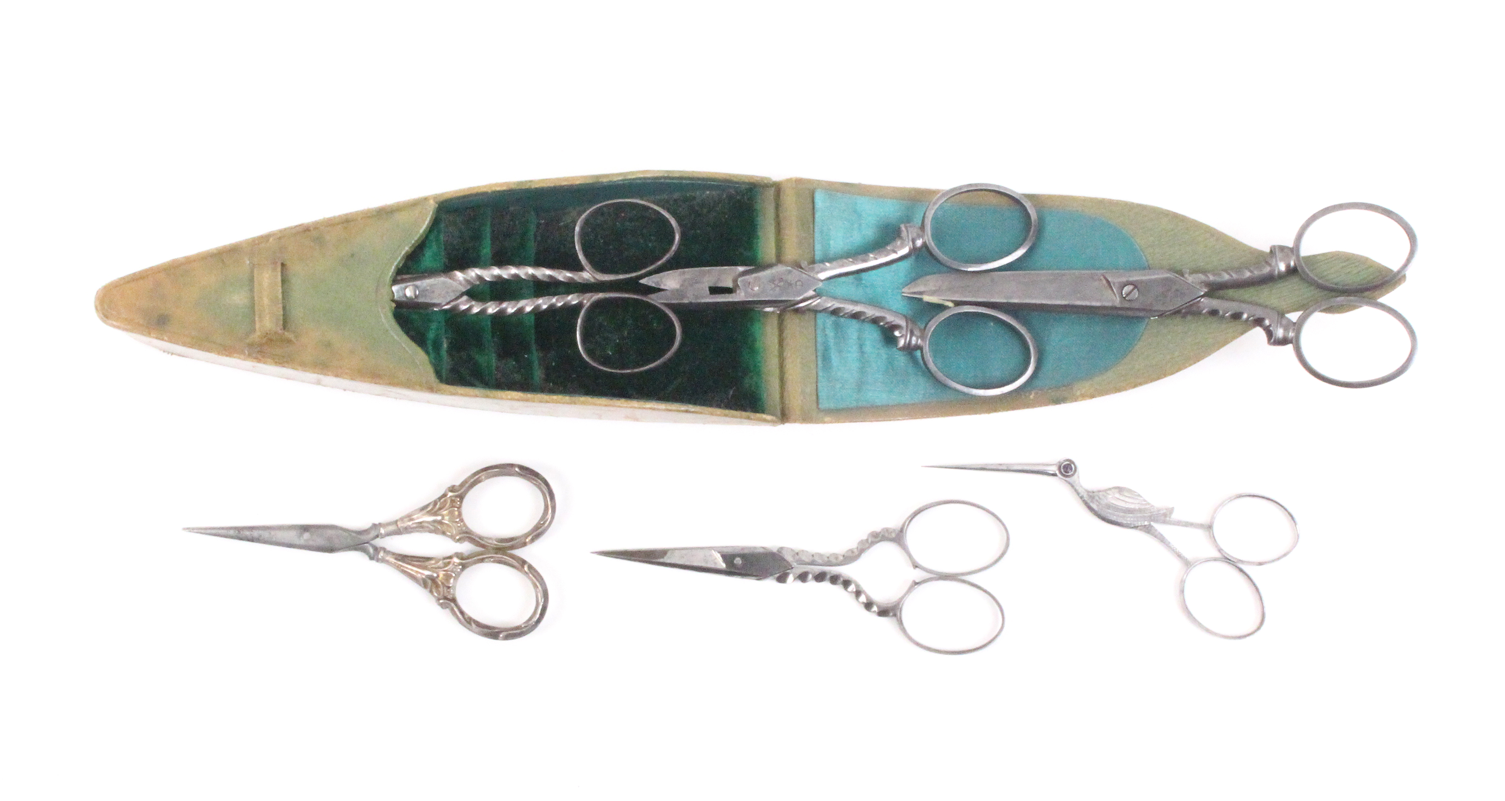 Two pairs of steel scissors and a cased set of scissors, comprising a good pair in the form of a