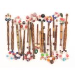 Eighteen 19th Century wooden lace bobbins comprising thirteen bitted, four wire bound and a silver