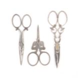 Three pairs of 19th Century steel scissors, comprising a pair with oval section tapering blades