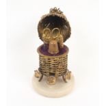 A French gilt metal novelty etui in the form of a beehive, circa 1870, on circular alabaster base,