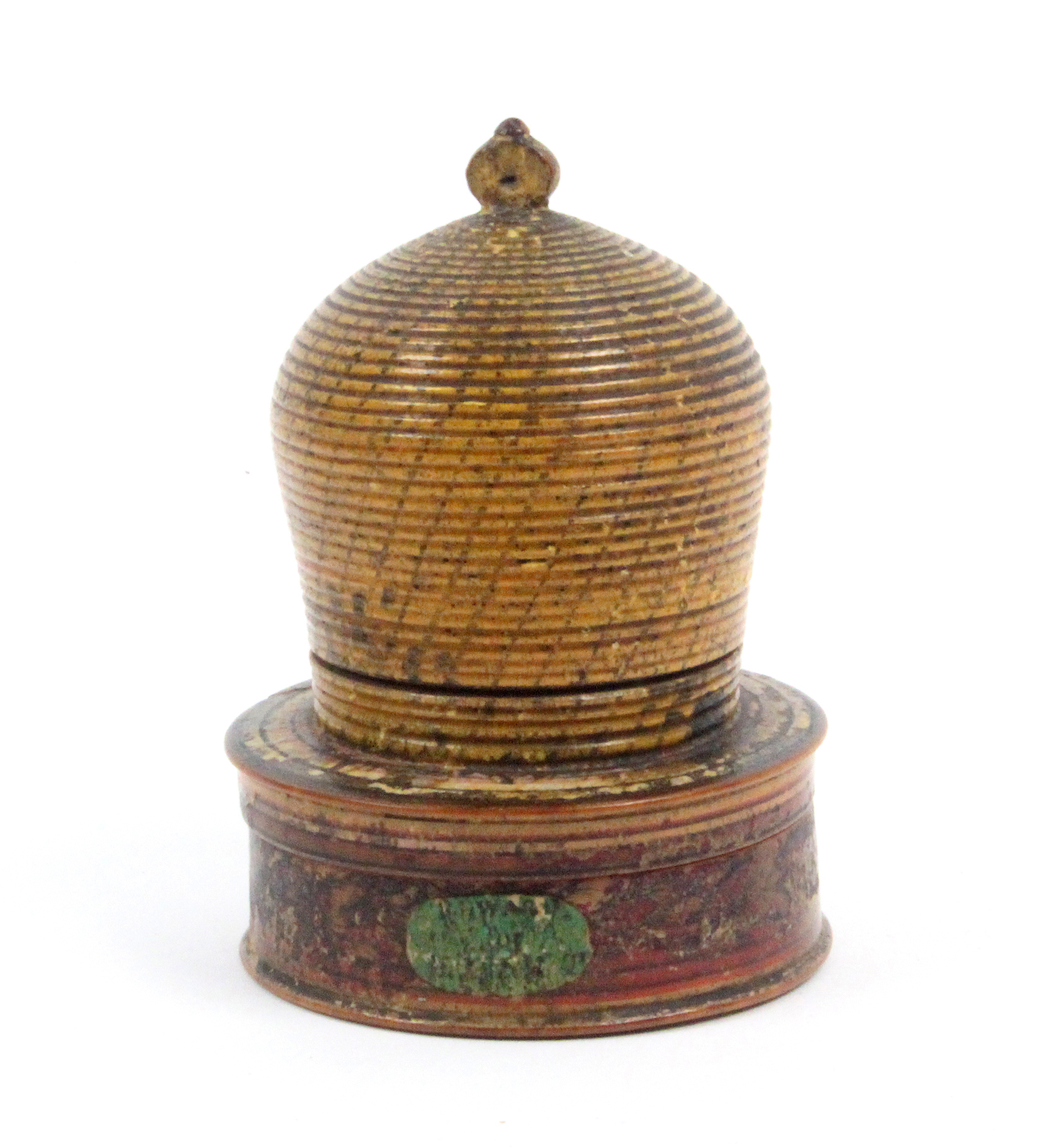 A painted Tunbridge ware pin cushion in the form of a bee skep, on screw off box form base with