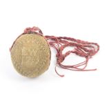 An 18th Century dated knitted pin ball, one side depicting a three masted sailing ship, the other