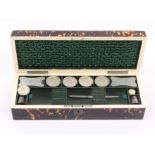 A fine tortoiseshell rectangular sewing box by Lund, circa 1850, the lid interior in ruched green