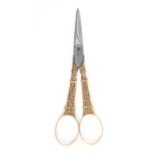 A fine pair of French gold mounted scissors, circa 1790, steel tapering oval section blades each