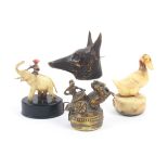 Four novelty celluloid tape measures comprising an elephant and rider, a duck, an alsation or wolf