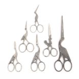 Six pairs of 19th Century steel scissors, comprising five pairs shaped and decorated as a stork