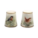 Two Royal Worcester porcelain puce mark thimbles by Powell, the first painted with a bird on a leafy